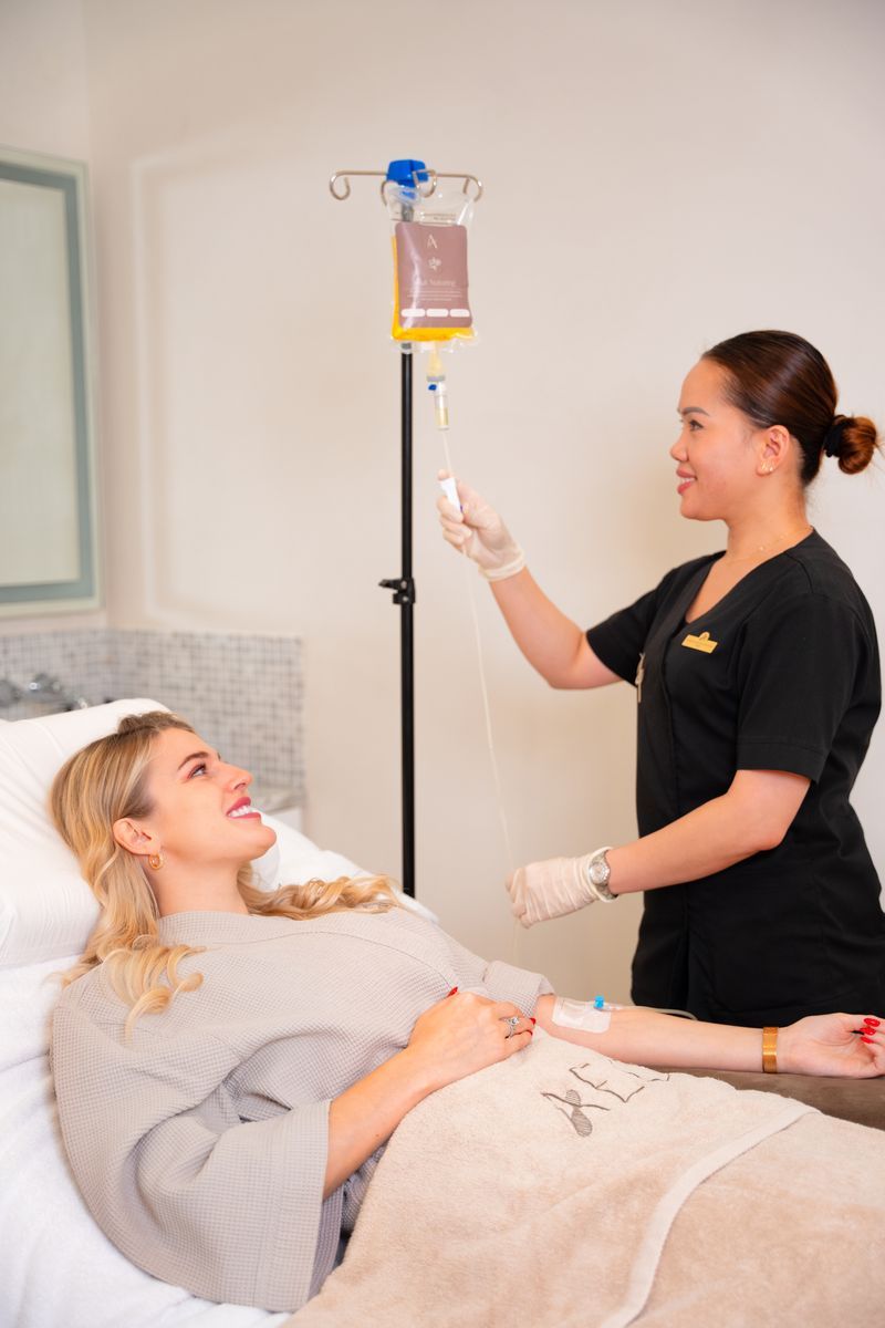 A client receives an intravenous wellness infusion in the clinic.
